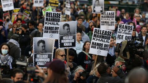 Demonstrators hold placards during a protest following the arrest by US immigration agents of Palestinian student protester Mahmoud Khalil at Columbia University, at Foley Square in New York City, U.S., March 10, 2025. REUTERS/Jeenah Moon
