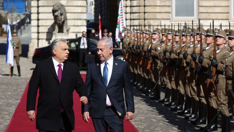 Hungarian Prime Minister Viktor Orban and Israeli Prime Minister Benjamin Netanyahu walk on the red carpet during a welcoming ceremony at the Lion's Courtyard in Budapest, Hungary, on Thursday.