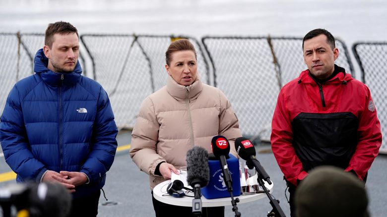 Danish Prime Minister Mette Frederiksen, center, attends a news conference aboard a Danish navy ship in Nuuk, Greenland, on Thursday with current head of government Múte B. Egede, right, and newly elected Greenlandic Prime Minister Jens-Frederik Nielsen.
