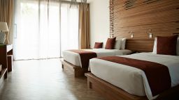 View of beds in hotel room at tourist resort