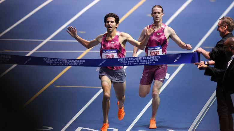 US Grant Fisher (L) competes and wins the 3000m men event and breaking the World Record (us cole hocker finishes second) at the 117th Millrose Games at « The Armory » track and field center in New York City on February 8, 2025.