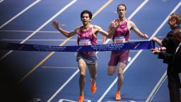 US Grant Fisher (L) competes and wins the 3000m men event and breaking the World Record (us cole hocker finishes second) at the 117th Millrose Games at « The Armory » track and field center in New York City on February 8, 2025.