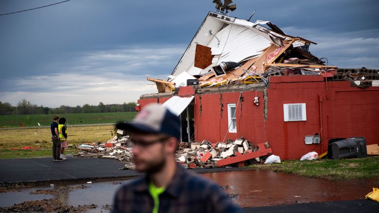 PADUCAH, KENTUCKY - APRIL 3: Parishioners and community members look over damage after a tornado struck the Christ Community Church on April 3, 2025 in Paducah, Kentucky. Kentucky Governor Andy Beshear issued a state of emergency ahead of the storms that are expected to cause flash flooding and tornadoes across Kentucky.  (Photo by Michael Swensen/Getty Images)