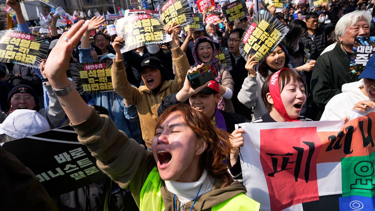 Protesters celebrate after South Korea's Constitutional Court removes impeached President Yoon Suk Yeol from power in Seoul, South Korea on Friday, April 4, 2025.